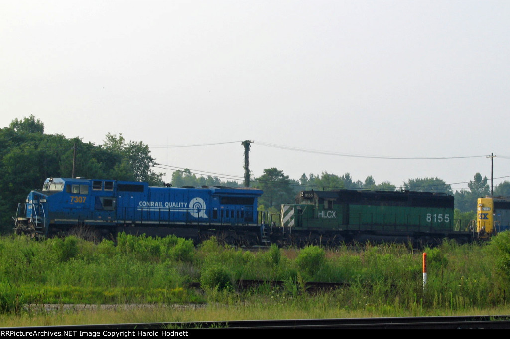 CSX 7307 leads a train out of the yard